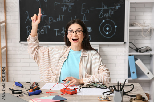 Female inventor pointing at...