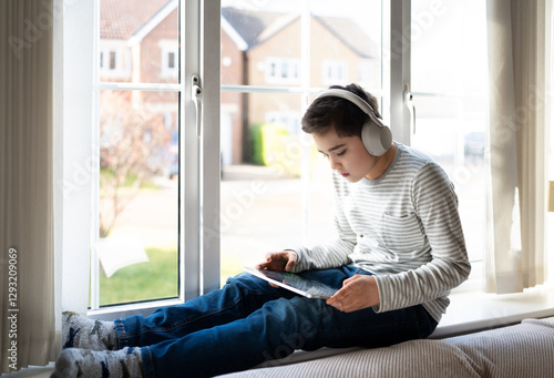 Kid Online Education,Asian Child using tablet technology for homework,Schoolboy wearing headphones listen and reading information from internet, Kindergarten learning world environment,Back to school Free Download Kid Online Education,Asian Child using tablet technology for homework,Schoolboy wearing headphones listen and reading information from internet, Kindergarten learning world environment,Back to school - GFXLoad