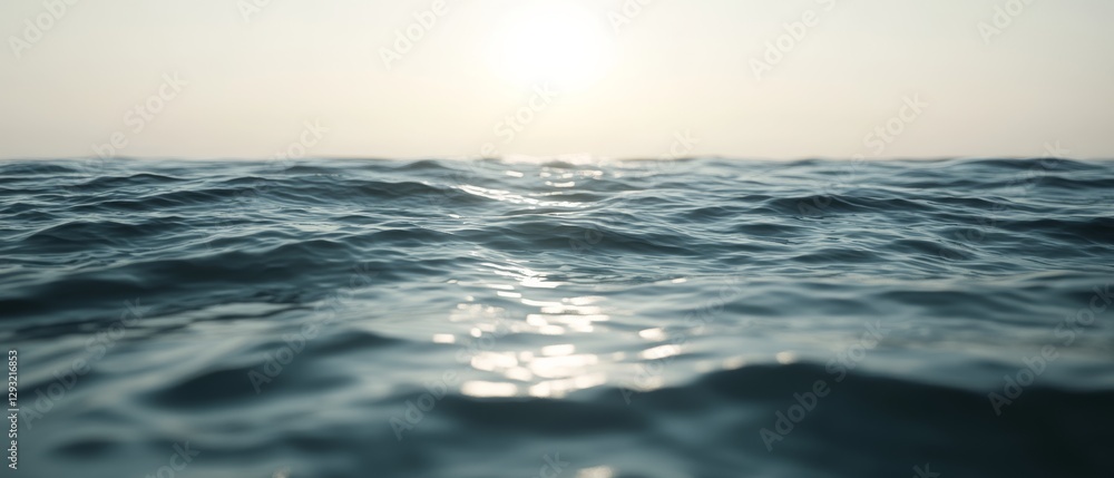 Obraz premium The ocean is calm and the sun is setting, creating a serene