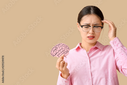 Young Asian woman with pape...