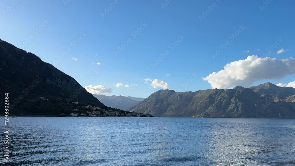 Breathtaking view  sea surrounded  majestic mountains sunny summer day.wilderness, freedom,independent travel. adventure and nature concepts.