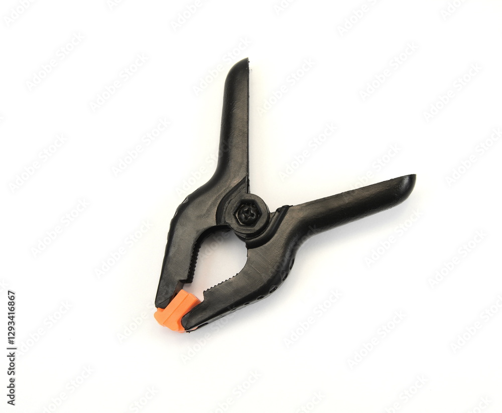 Black plastic clamp, isolated on a white background. Black plastic clamp, isolated on a white background.