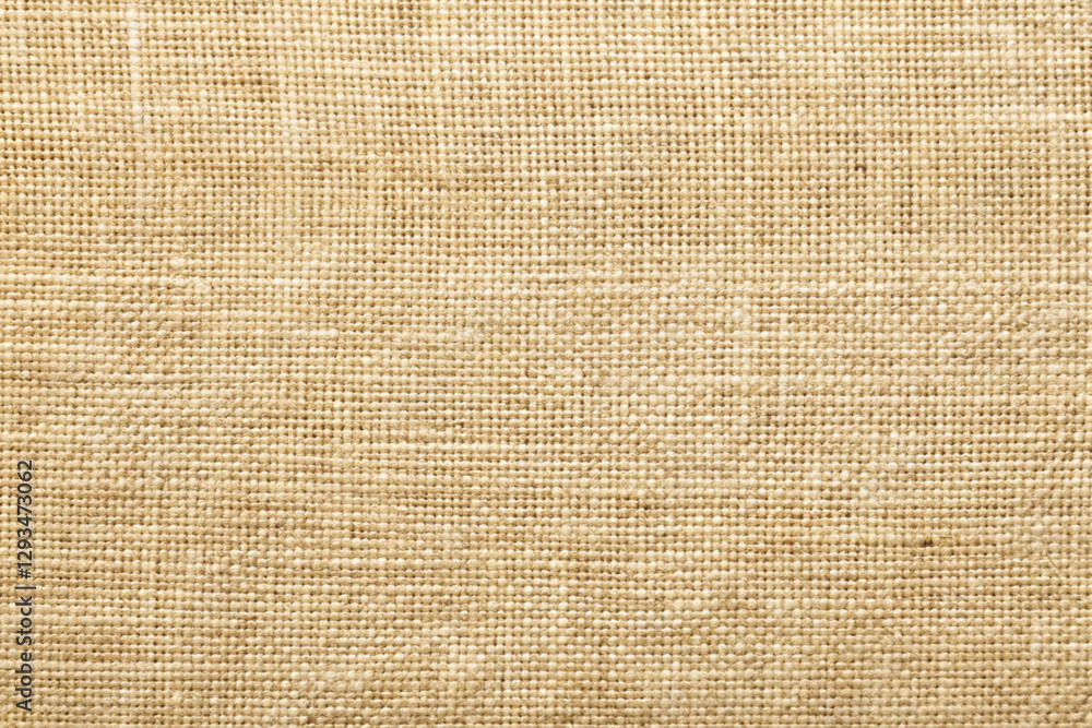 Woven texture of natural linen fabric in soft beige color with subtle variations Woven texture of natural linen fabric in soft beige color with subtle variations