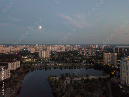 Aerial View of Kyiv, Ukraine – Dnipro River, Bridges and Sunset Above the Clouds