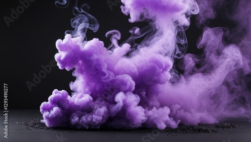 Vibrant purple smoke billowing on a black background creating an abstract and dramatic visual effect for artistic compositions