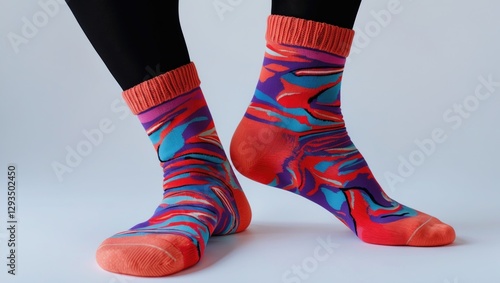 Colorful patterned socks on a white background showcasing a vibrant design perfect for fashion or lifestyle themes. photo