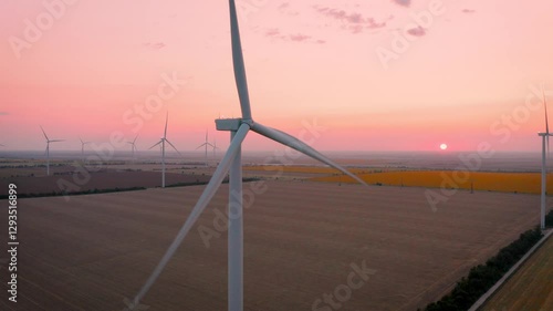 Wind turbines at sunset, aerial view