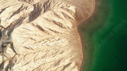 Soil erosion on the shore of emerald lake