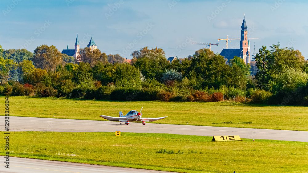 Fototapeta premium Autumn or indian summer view with sports aircraft at Straubing airport, Straubing-Bogen, Bavaria, Germany