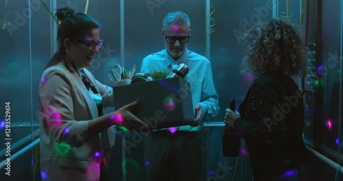 Employees celebrating in the elevator, they cheer up and engage their colleague who has just been fired and he joins the party