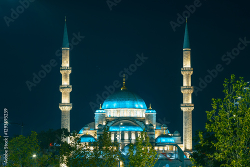 Eminonu Yeni Cami or New Mosque view at night. Ramadan or islamic concept photo