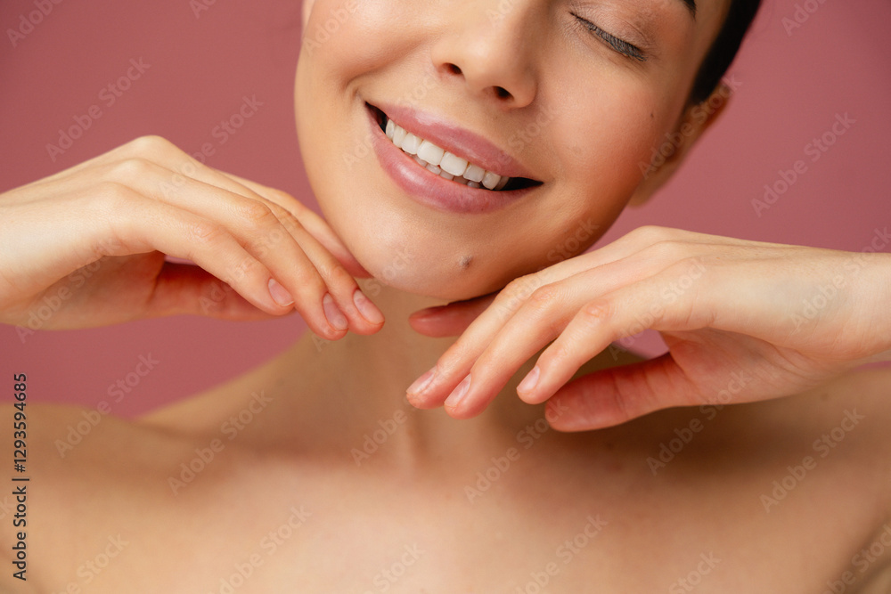 Bright and cheerful close-up of a smiling face with hands elegantly posed, showcasing natural beauty and a joyful emotion. Bright and cheerful close-up of a smiling face with hands elegantly posed, showcasing natural beauty and a joyful emotion.