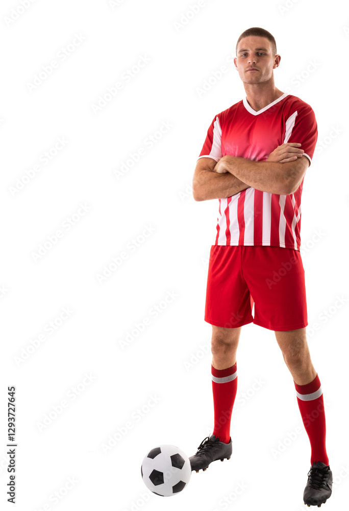 Confident soccer player in red uniform standing with arms crossed and ball, copy space Confident soccer player in red uniform standing with arms crossed and ball, copy space
