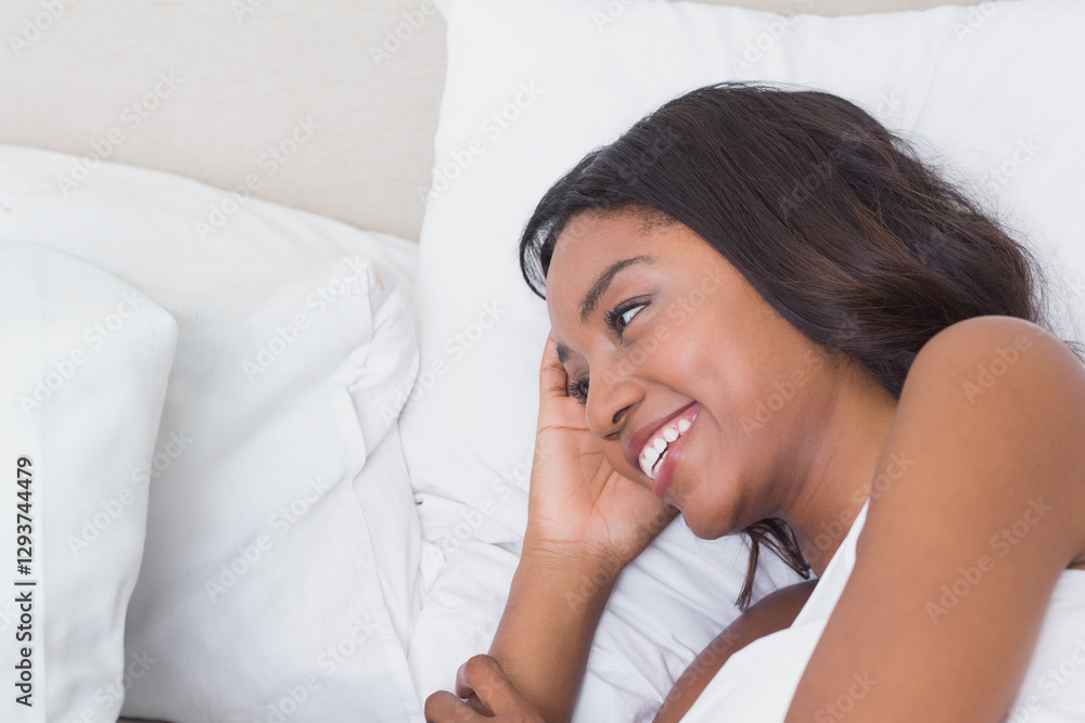 Smiling woman relaxing in bed, enjoying peaceful morning at home, copy space Smiling woman relaxing in bed, enjoying peaceful morning at home, copy space