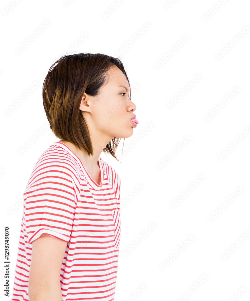 Asian woman in striped shirt playfully puckering lips, expressing fun mood Asian woman in striped shirt playfully puckering lips, expressing fun mood