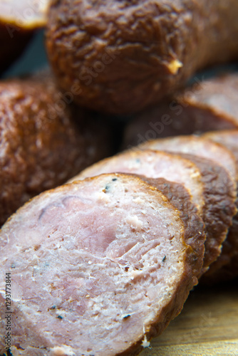 Obraz na płótnie Dry smoked sausage, medium minced. Traditional taste and appetizing aroma.
w salonie
