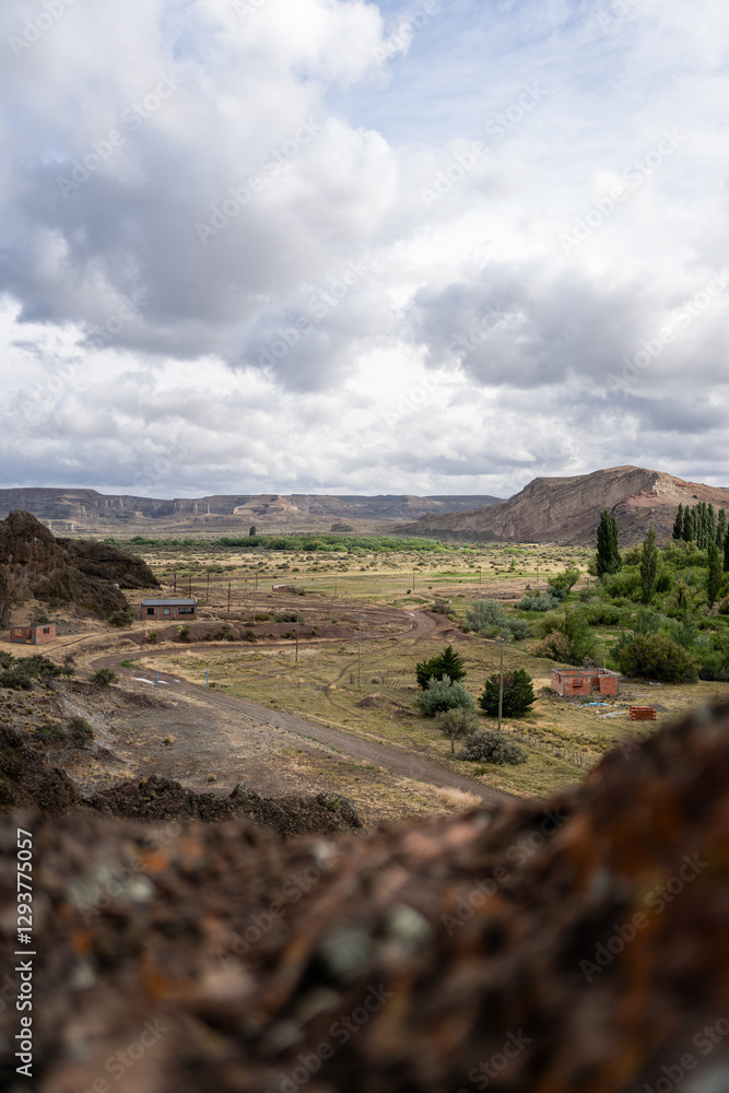 Fototapeta premium Rural area surrounded by natural landscape in Los Altares, Chubut province, Argentina