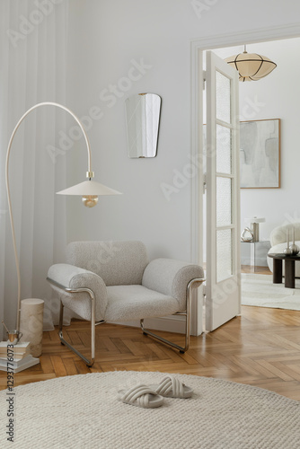 Cozy reading corner with a boucle armchair, soft lighting, and layered natural textures.