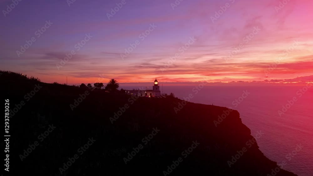 Sunset view at Ponta do Pargo lighthouse in Madeira surrounded by stunning coastal scenery and vibrant sky colors Sunset view at Ponta do Pargo lighthouse in Madeira surrounded by stunning coastal scenery and vibrant sky colors