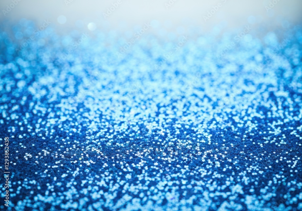Shimmering blue glitter creating a sparkling background effect Shimmering blue glitter creating a sparkling background effect