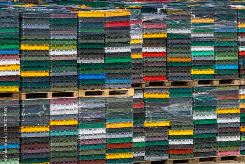 Bilde på lerret Colorful boxes stacked in a port against a blue sky, transport of goods by sea,
