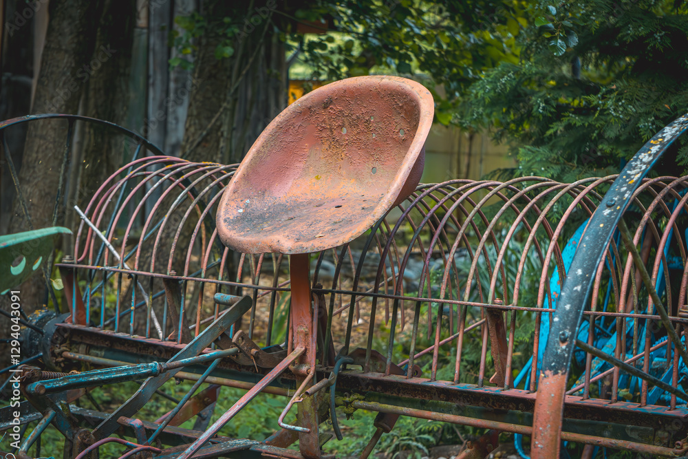 an old, historic agricultural machine attached to a horse with a metal saddle. the history of agriculture