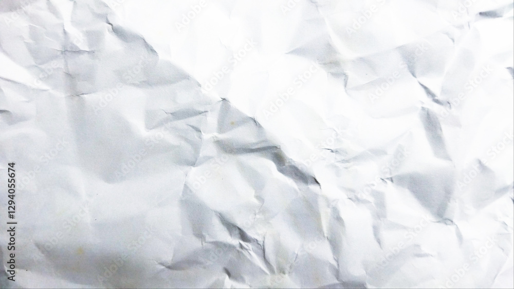 Fototapeta premium Clean white wrinkled paper texture ideal for backgrounds, design mockups, and material effects within creative projects.