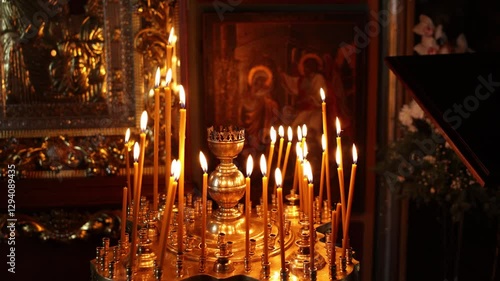 candles are burning in the orthodox church in the middle