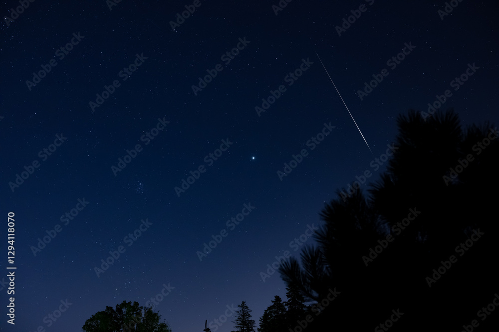 Fototapeta premium Perseid meteor shower, Milky way stars and landscape silhouettes