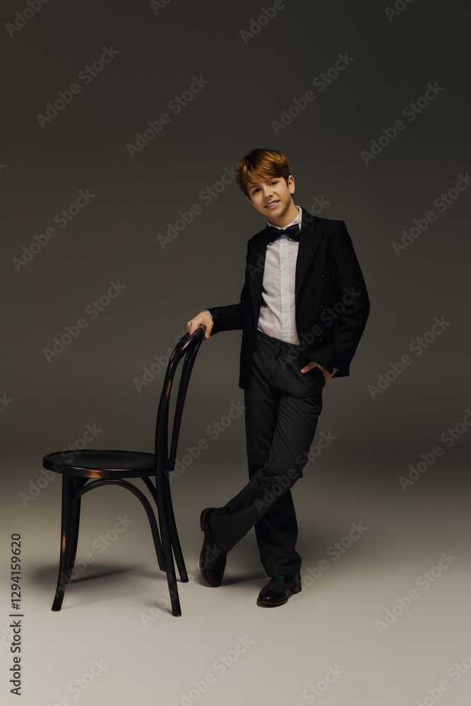 Elegant preteen boy showcasing stylish fashion in a studio setting with charm Elegant preteen boy showcasing stylish fashion in a studio setting with charm