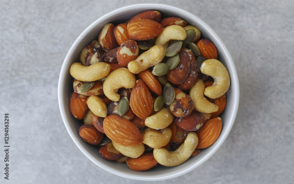 Delicious Mixed Nuts and Seeds in Bowl- Almonds, Cashews, Brazil Nuts, Pumpkin Seeds Delicious Mixed Nuts and Seeds in Bowl- Almonds, Cashews, Brazil Nuts, Pumpkin Seeds