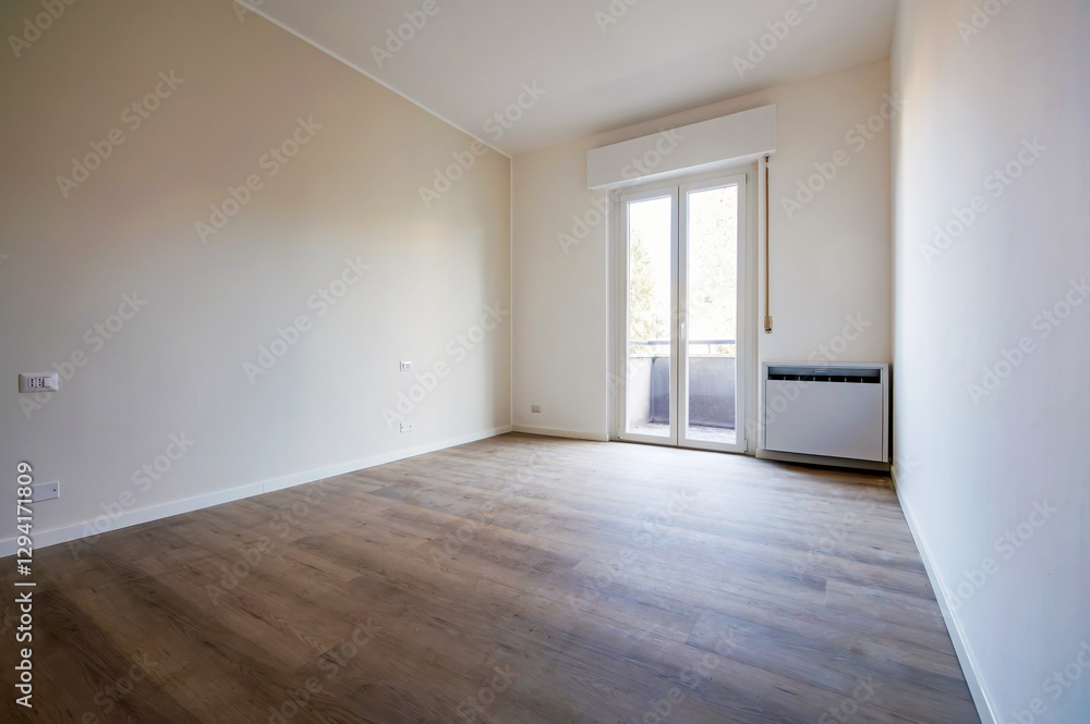 Fototapeta premium Empty apartment room with wooden floor and balcony door