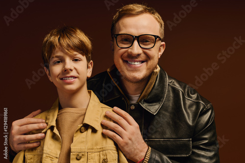 Cuadro en lienzo Joyful moments shared between father and son in casual studio outfits