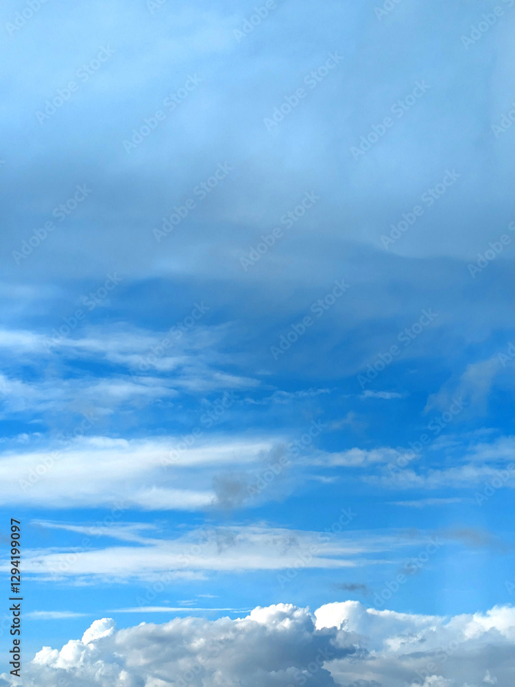 Obraz premium Beautiful Large White Clouds in a Calm Blue Sky