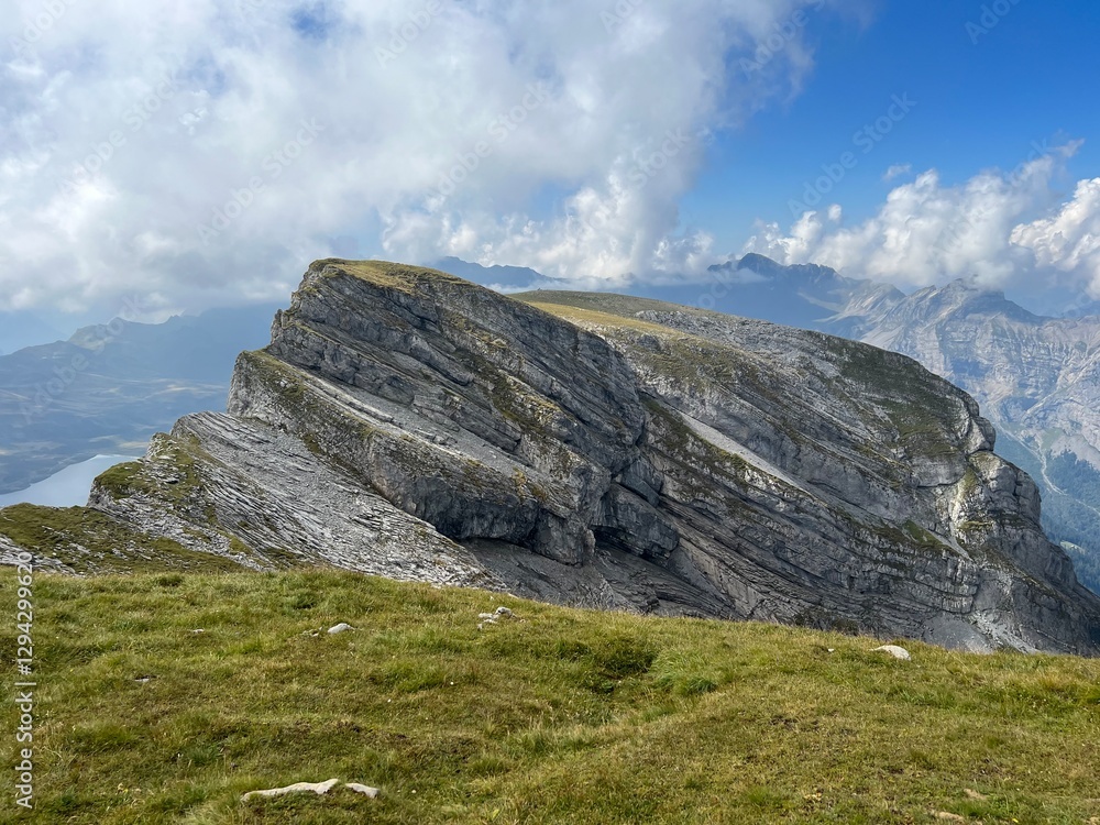 Alpine peaks Chli Hohmad (2492 m) and Gross Hohmad (2307 m) above the Tannensee lake (or Tannen lake) and in the Uri Alps mountain massif, Melchtal - Canton of Obwalden, Switzerland (Schweiz) Alpine peaks Chli Hohmad (2492 m) and Gross Hohmad (2307 m) above the Tannensee lake (or Tannen lake) and in the Uri Alps mountain massif, Melchtal - Canton of Obwalden, Switzerland (Schweiz)