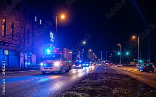Ambulance at night in Berlin, Germany, Ambulance, Police Car in Action on a Road, blurry, abstract, out of focus, symbol picture