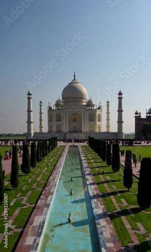 Majestic view of the taj mahal with reflective pool and clear sky at different times