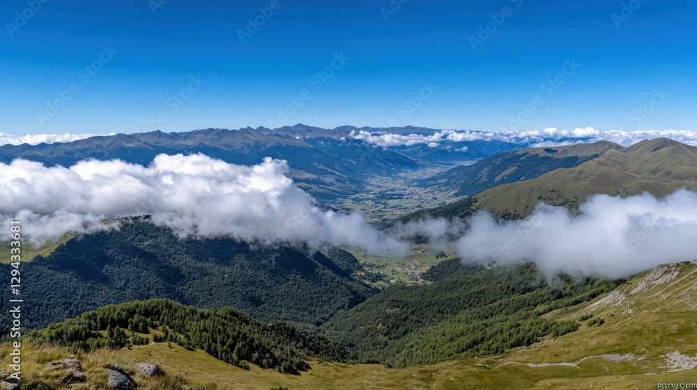 Fototapeta premium A skydiver pierces through fluffy white clouds against an expansive view of the verdant valley below.
