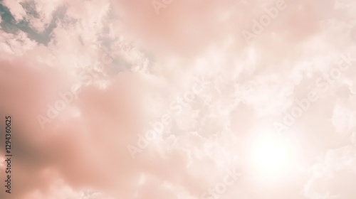 Fototapeta Naklejka Na Ścianę i Meble -  A calm sky with clouds partly covering the sun, diffusing the light and creating a tranquil and soft atmosphere.