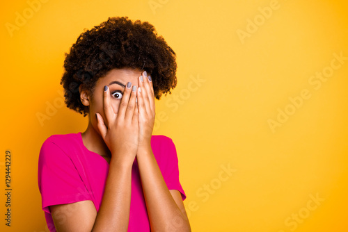 Copyspace photo of scared terrified casual lady covering her face with hands not to see terrifying things she is afraid of while isolated over vibrant color background photo