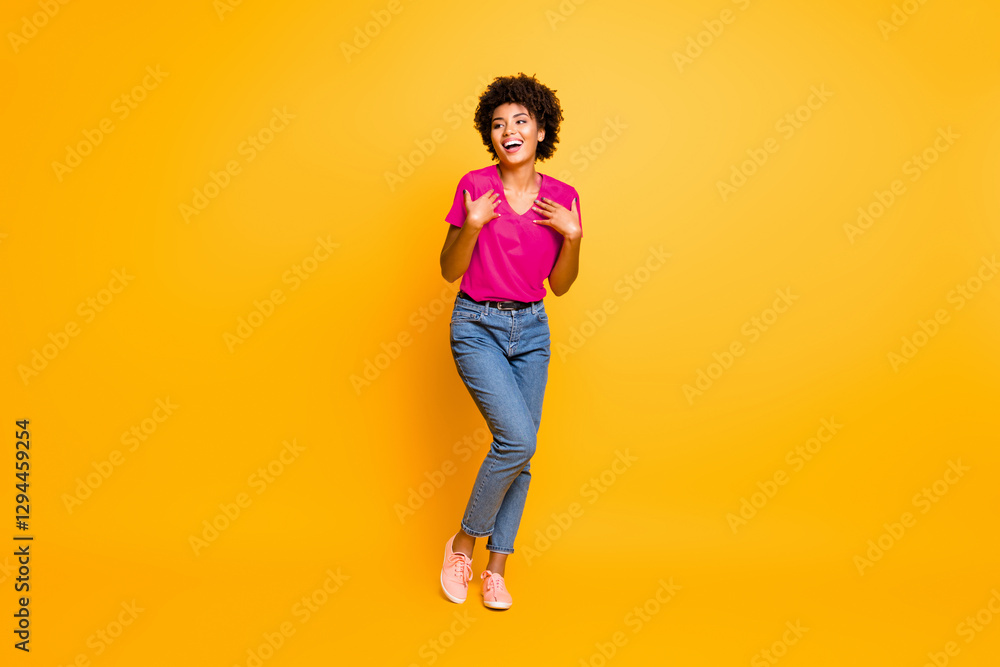 Full length body size photo of cheerful curly wavy black lady wearing jeans denim unable to believe in being chosen excited rejoicing isolated over yellow vivid color background Full length body size photo of cheerful curly wavy black lady wearing jeans denim unable to believe in being chosen excited rejoicing isolated over yellow vivid color background