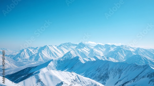 Wallpaper Mural Endless snowy mountain ridges stretch under a bright blue sky, evoking a sense of vast wilderness and freedom. Torontodigital.ca