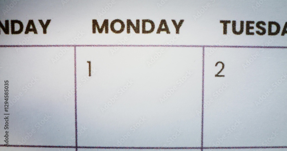 The person circles the inscription Monday in the calendar with a red marker. Close-up of the marker The person circles the inscription Monday in the calendar with a red marker. Close-up of the marker