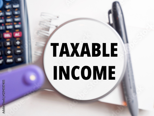Taxable Income text under magnification tax background