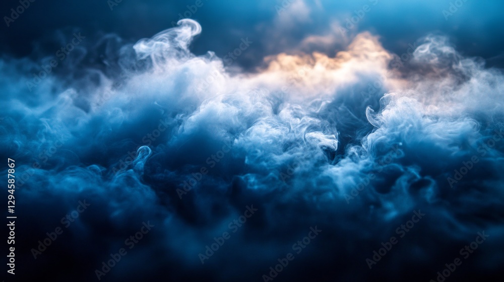 Obraz premium In a tranquil moment, delicate clouds of blue and gray intertwine, revealing hints of golden light. This captivating fog adds an enchanting layer to the quiet landscape at dawn