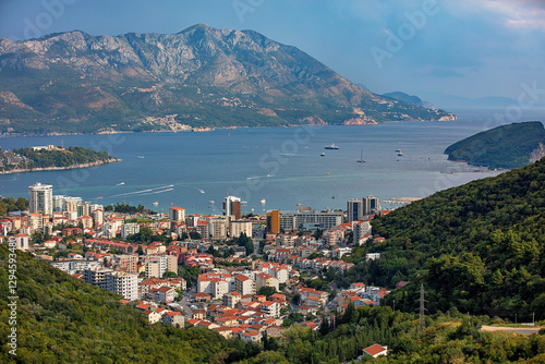 A stunning coastal view of a bay surrounded by mountains in the bustling seaside town of Budva.