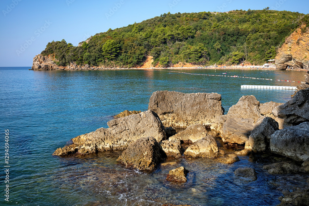 Coastal tranquility at the shimmering beach during a bright summer afternoon