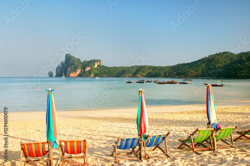 Umrellas and sunchairs at Ao Loh Dalum beach on Phi Phi Don Island, Krabi Province, Thailand