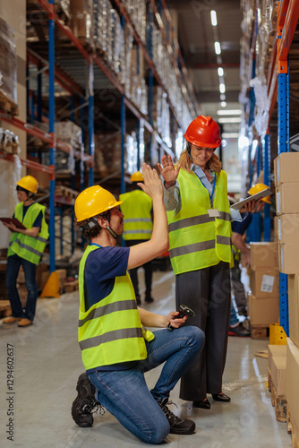 Slika na platnu High-five between a warehouse worker and a foreman