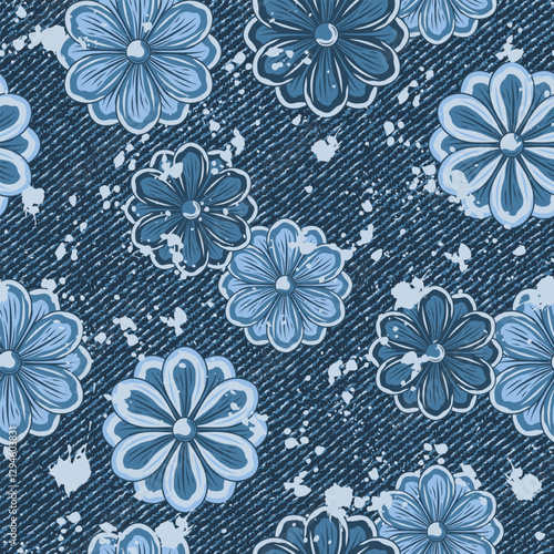 Seamless summer denim pattern with scattered chamomile flowers, splattered paint. Random composition. Grunge boho style. Dotted textured background.